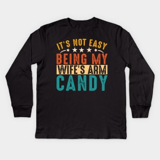 It's not easy being my wife's arm candy Kids Long Sleeve T-Shirt